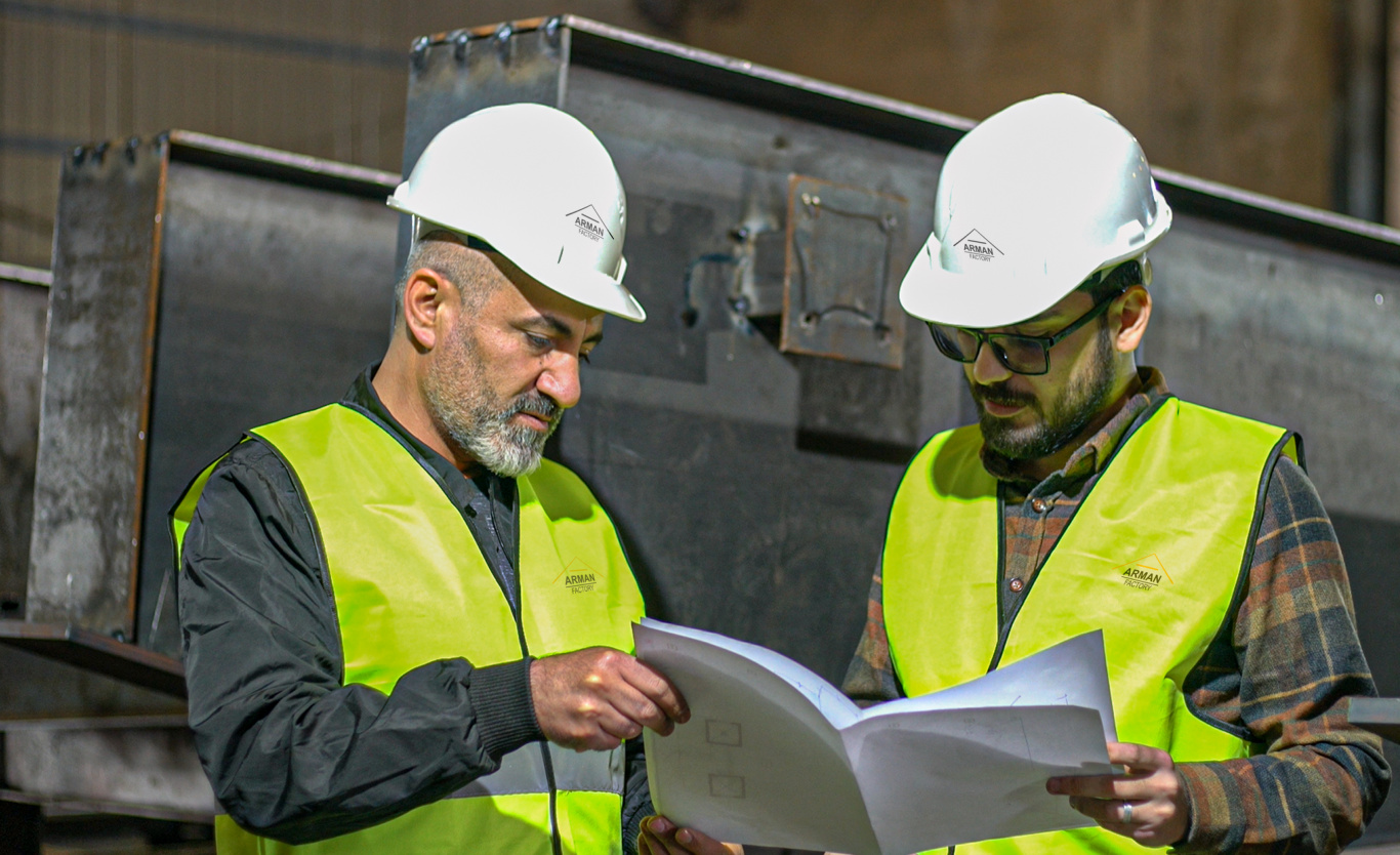 ARMAN Factory team reviewing fabrication drawings